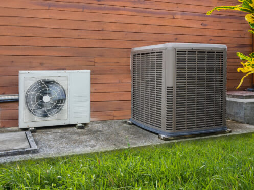 Air conditioner and heat pump in the backyard of a Phoenix home